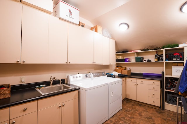 laundry area featuring cabinet space, independent washer and dryer, and stone finish flooring