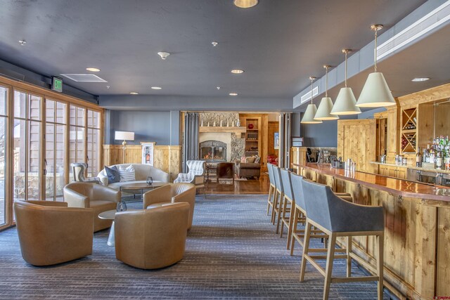 lobby featuring a wainscoted wall and wood walls