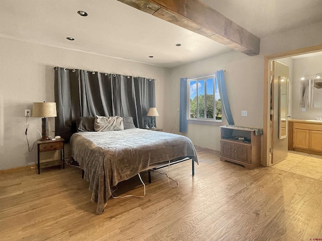 175 County Road J6, Egnar, CO 81325 - bedroom featuring light wood-style flooring, beam ceiling, connected bathroom, recessed lighting, and a sink