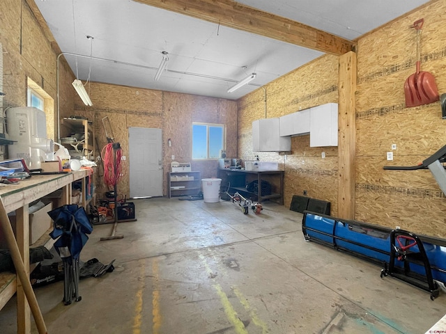 175 County Road J6, Egnar, CO 81325 - miscellaneous room with a workshop area, concrete floors, and a garage
