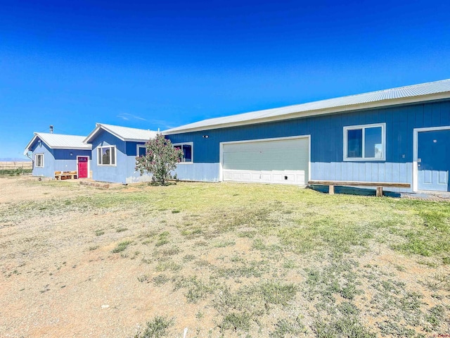 175 County Road J6, Egnar, CO 81325 - view of front of property with an attached garage and metal roof