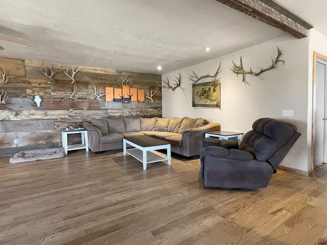 175 County Road J6, Egnar, CO 81325 - living area featuring wood finished floors, a textured ceiling, beam ceiling, and recessed lighting