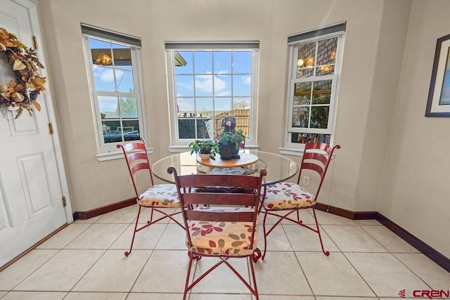 1060 Alta Vista Dr, Craig, CO 81625 - dining room with light tile patterned floors and baseboards