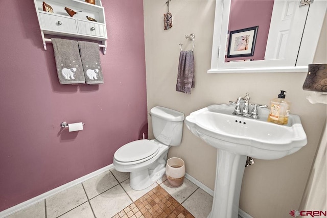 1060 Alta Vista Dr, Craig, CO 81625 - bathroom with baseboards, toilet, and tile patterned flooring