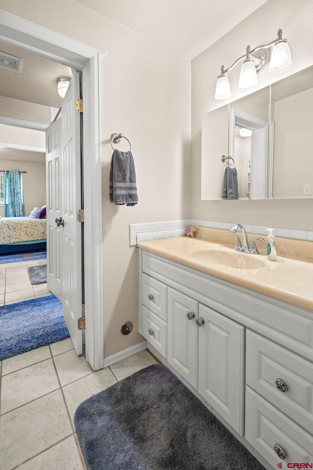 1060 Alta Vista Dr, Craig, CO 81625 - bathroom with tile patterned floors and vanity