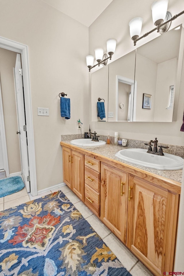 1060 Alta Vista Dr, Craig, CO 81625 - full bathroom with tile patterned flooring, double vanity, and baseboards