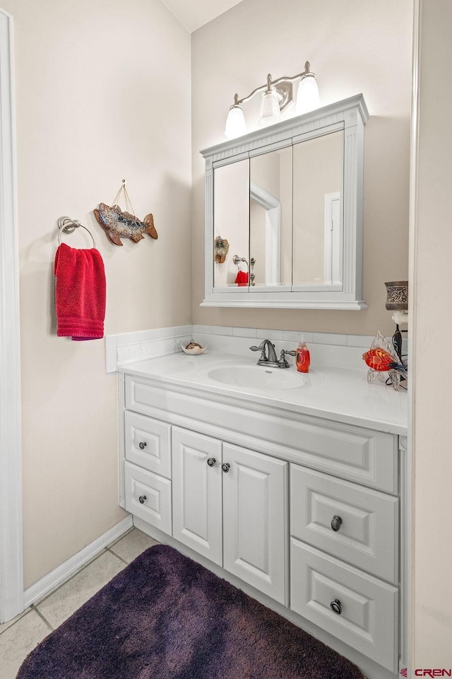 1060 Alta Vista Dr, Craig, CO 81625 - bathroom featuring vanity, tile patterned flooring, and baseboards