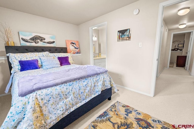 1060 Alta Vista Dr, Craig, CO 81625 - carpeted bedroom featuring baseboards and ensuite bath