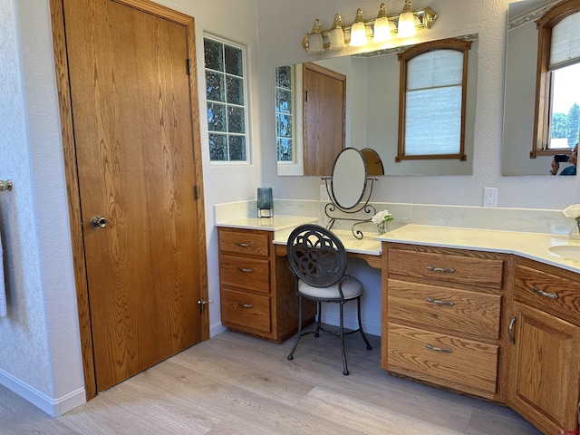 20 Meadow Ln, Monte Vista, CO 81144 - bathroom featuring wood finished floors, vanity, and a textured wall
