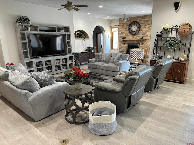 20 Meadow Ln, Monte Vista, CO 81144 - living area with a ceiling fan, arched walkways, light wood-style flooring, recessed lighting, and a fireplace