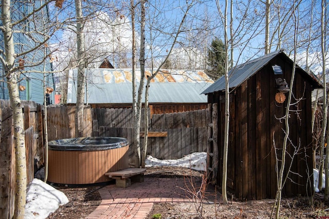 209 Whiterock Ave, Crested Butte, CO 81224 - fenced backyard with a hot tub and central AC unit