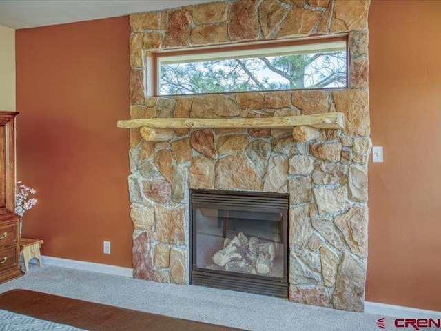 338 Escobar Ave, Pagosa Springs, CO 81147 - detailed view of carpet flooring, a stone fireplace, and baseboards