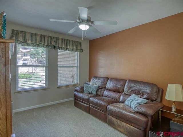 338 Escobar Ave, Pagosa Springs, CO 81147 - living area featuring carpet floors, healthy amount of natural light, ceiling fan, and baseboards