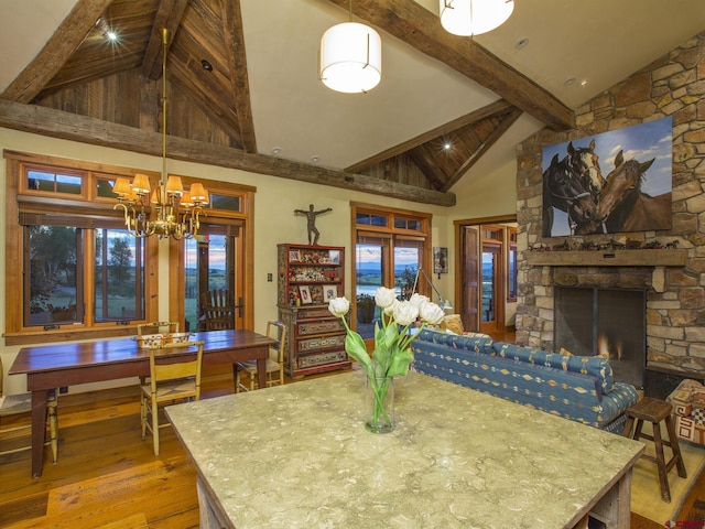 1789 County Road 44z S, Norwood, CO 81423 - dining space with hardwood / wood-style floors, beamed ceiling, a chandelier, high vaulted ceiling, and a fireplace