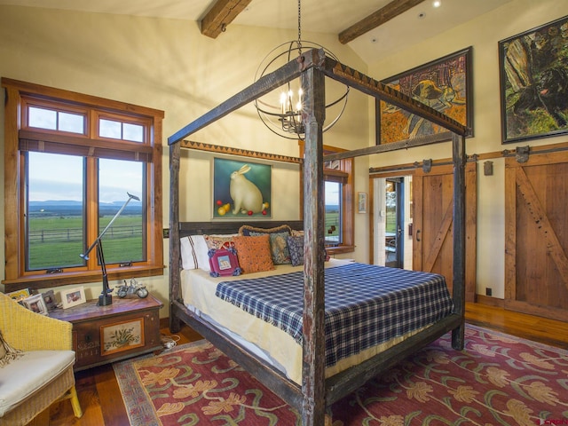 1789 County Road 44z S, Norwood, CO 81423 - bedroom featuring beam ceiling, wood finished floors, a chandelier, and high vaulted ceiling