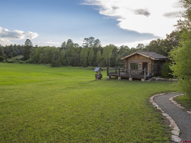 1789 County Road 44z S, Norwood, CO 81423 - view of green lawn with a wooden deck