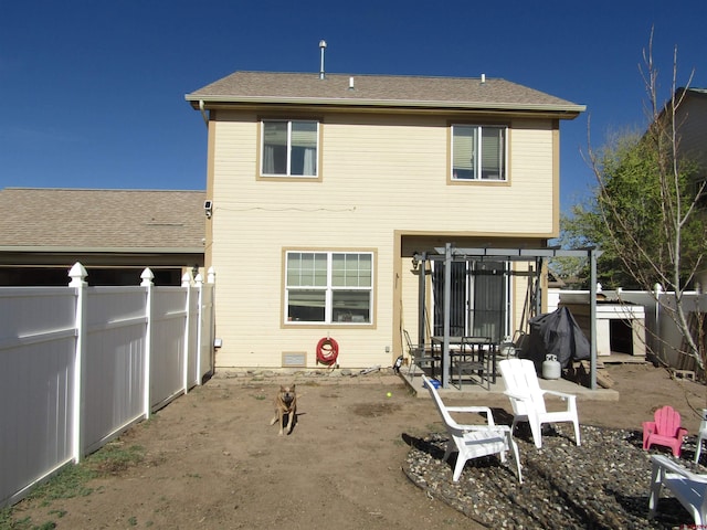 back of house featuring fence