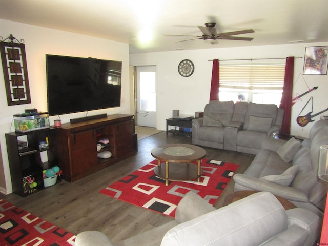 living room featuring wood finished floors, plenty of natural light, and ceiling fan