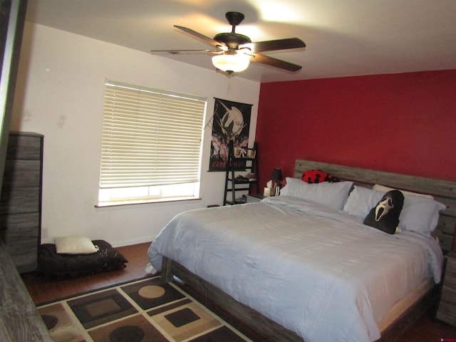 bedroom with wood finished floors and a ceiling fan