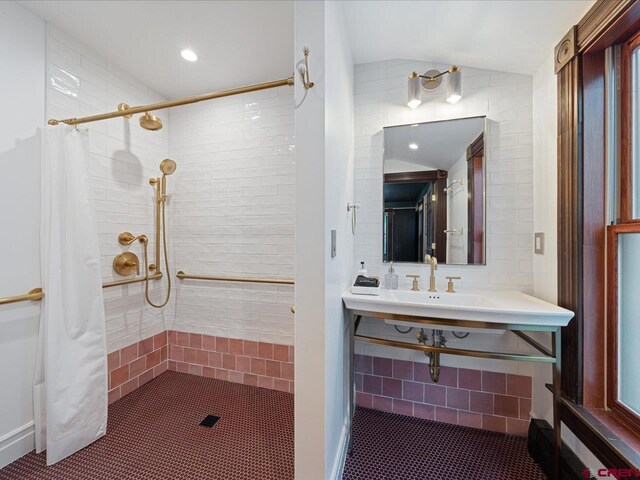 645 2nd St, Ouray, CO 81427 - full bath featuring tiled shower, lofted ceiling, and tile patterned flooring