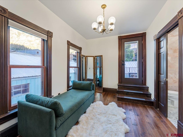 645 2nd St, Ouray, CO 81427 - sitting room with a chandelier, dark wood-style flooring, healthy amount of natural light, and baseboards