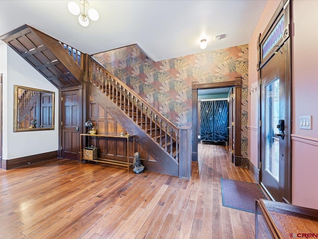 645 2nd St, Ouray, CO 81427 - entryway with stairs, wallpapered walls, hardwood / wood-style floors, healthy amount of natural light, and baseboards