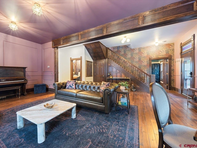 645 2nd St, Ouray, CO 81427 - living area with stairway, wallpapered walls, and wood finished floors