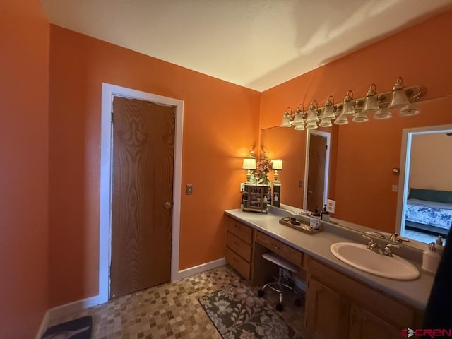 15556 D Rd, Delta, CO 81416 - ensuite bathroom featuring vanity and baseboards