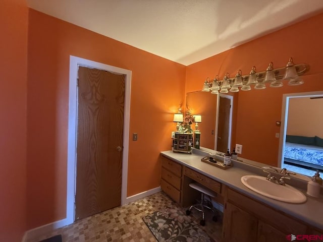 15556 D Rd, Delta, CO 81416 - bathroom with vanity and baseboards