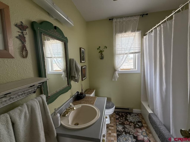 15556 D Rd, Delta, CO 81416 - bathroom with a baseboard radiator, toilet, vanity, and baseboards