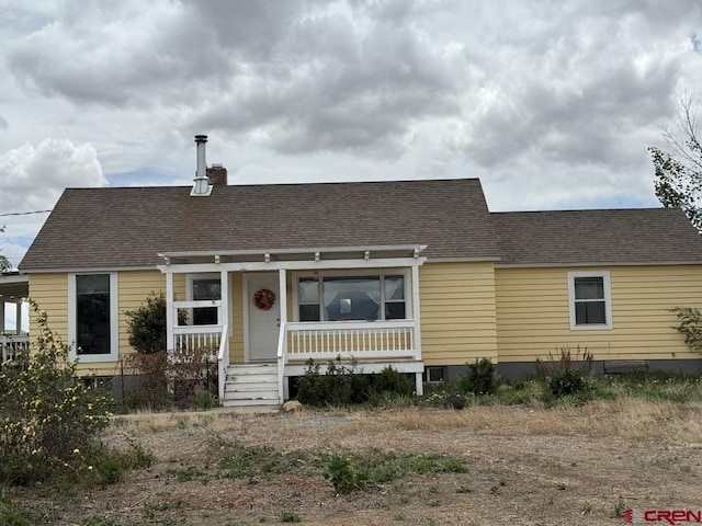 15556 D Rd, Delta, CO 81416 - cape cod house with a porch, a chimney, and roof with shingles