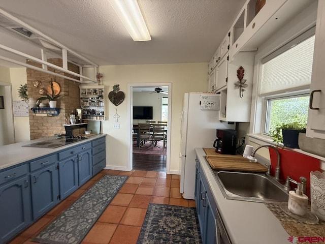 15556 D Rd, Delta, CO 81416 - kitchen featuring blue cabinetry, a ceiling fan, a sink, a textured ceiling, and black electric cooktop