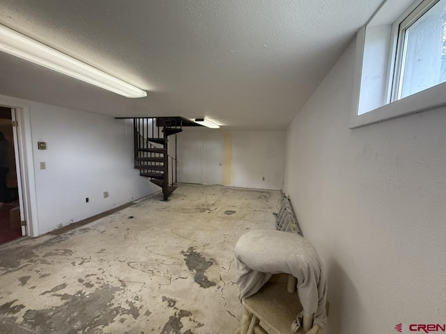 15556 D Rd, Delta, CO 81416 - basement featuring stairway and a textured ceiling