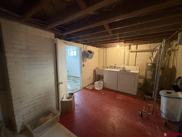 15556 D Rd, Delta, CO 81416 - basement featuring washer and dryer and electric water heater