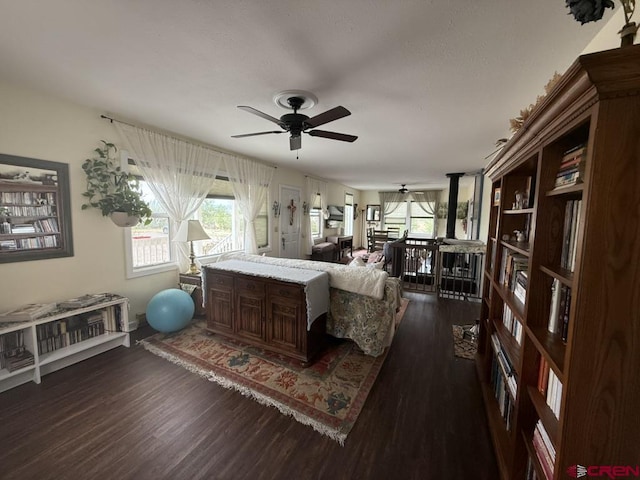 15556 D Rd, Delta, CO 81416 - living area featuring ceiling fan and dark wood-type flooring