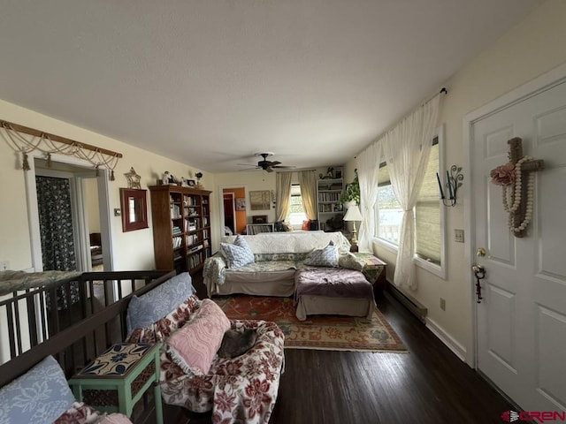 15556 D Rd, Delta, CO 81416 - living room featuring dark wood-style floors, ceiling fan, baseboards, and baseboard heating