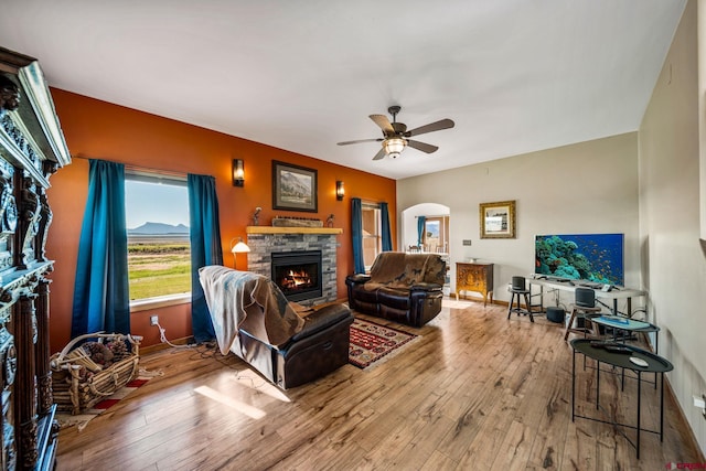 11611 Rd 28.1, Dolores, CO 81323 - living area with a fireplace, arched walkways, wood-type flooring, and ceiling fan