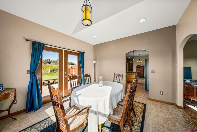 11611 Rd 28.1, Dolores, CO 81323 - dining area featuring arched walkways, french doors, light tile patterned floors, recessed lighting, and lofted ceiling