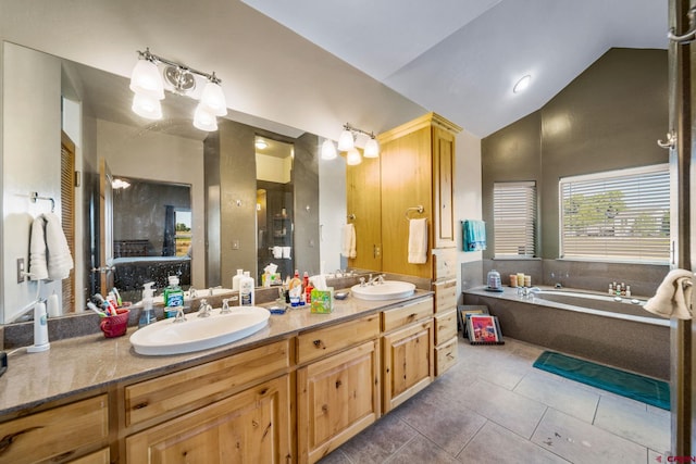 11611 Rd 28.1, Dolores, CO 81323 - bathroom featuring double vanity, a garden tub, tile patterned floors, and high vaulted ceiling