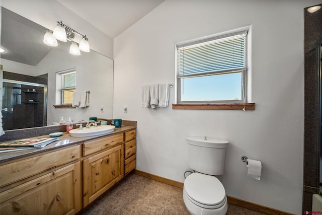 11611 Rd 28.1, Dolores, CO 81323 - bathroom featuring plenty of natural light, a stall shower, vanity, lofted ceiling, and tile patterned flooring