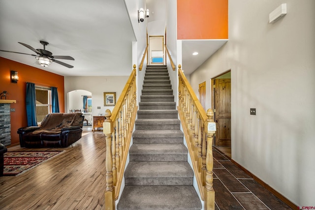 11611 Rd 28.1, Dolores, CO 81323 - stairway with arched walkways, a ceiling fan, and wood finished floors