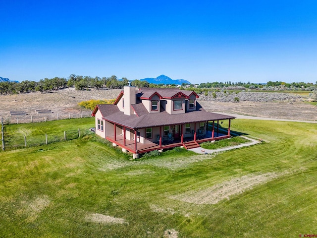 11611 Rd 28.1, Dolores, CO 81323 - rear view of property with a porch, a chimney, and a mountain view