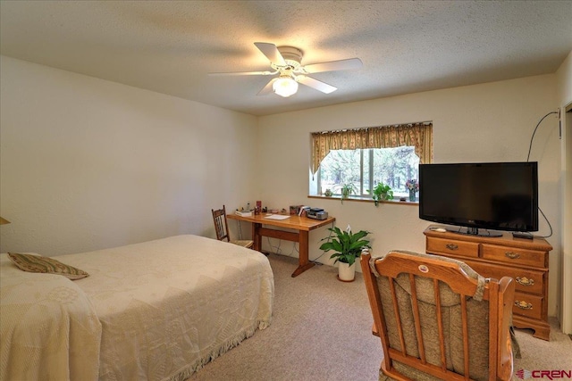 16 Mosswood Dr, Pagosa Springs, CO 81147 - bedroom featuring light carpet, a ceiling fan, and a textured ceiling