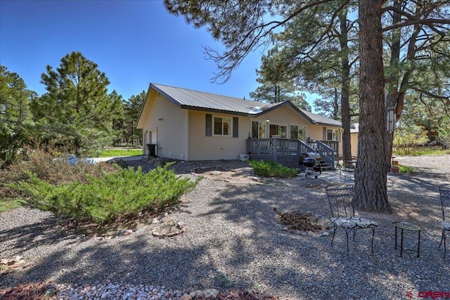 16 Mosswood Dr, Pagosa Springs, CO 81147 - view of front of property featuring a deck and metal roof