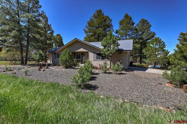 16 Mosswood Dr, Pagosa Springs, CO 81147 - view of front of home with metal roof