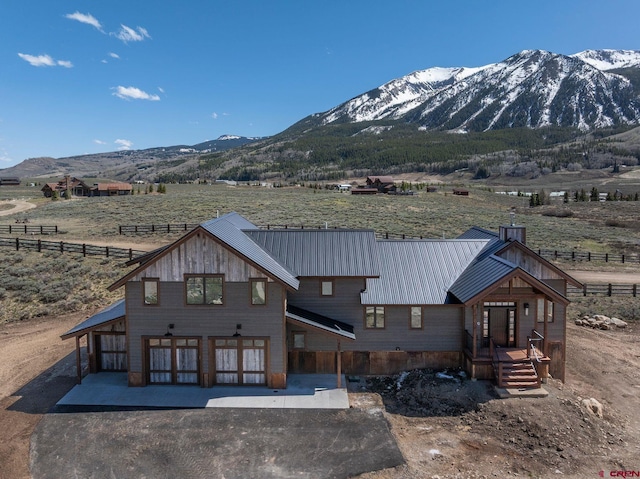 70 Lexie Ct, Crested Butte, CO 81224 - rear view of house featuring a mountain view, a view of rural / pastoral area, and metal roof