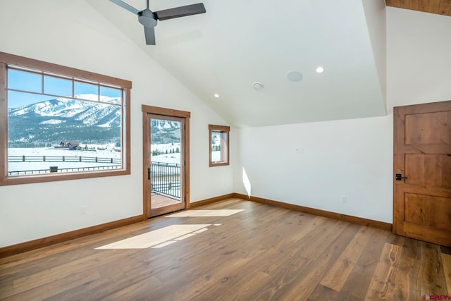 70 Lexie Ct, Crested Butte, CO 81224 - spare room featuring lofted ceiling, wood finished floors, baseboards, a ceiling fan, and recessed lighting