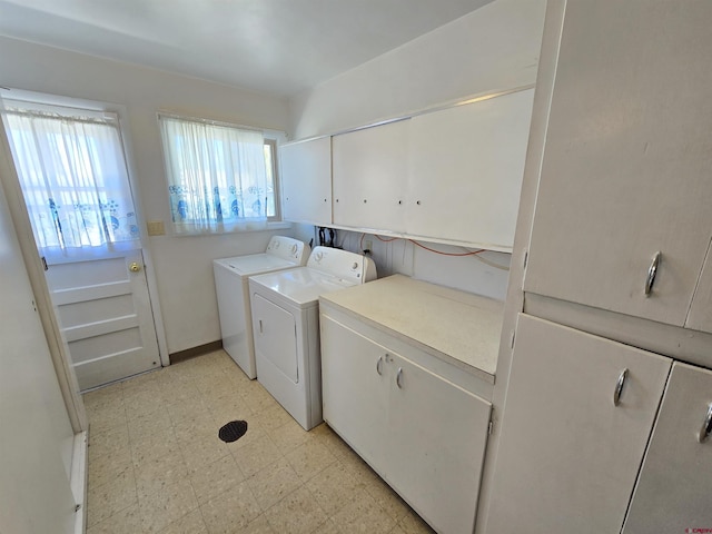 washroom featuring cabinet space, independent washer and dryer, and light flooring
