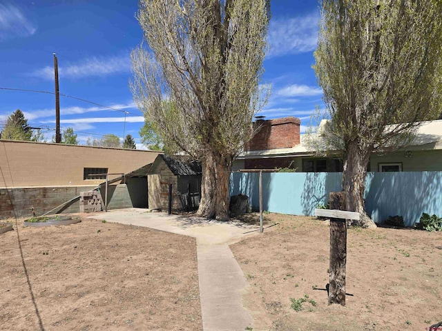 rear view of house with fence