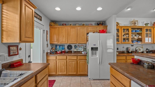 2384 Ridge Circle Dr Unit 14, Grand Junction, CO 81507 - kitchen featuring white appliances, dark countertops, light tile patterned floors, glass insert cabinets, and recessed lighting